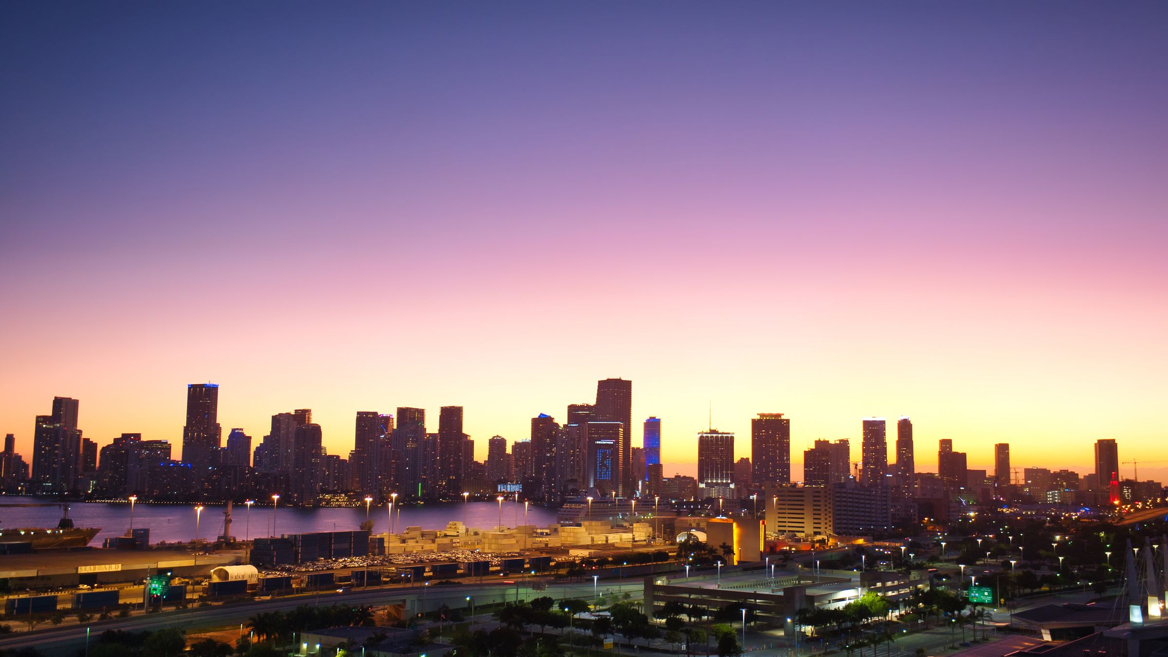 Crypto and blockchain events 2026: Miami Brickell financial district skyline at dusk