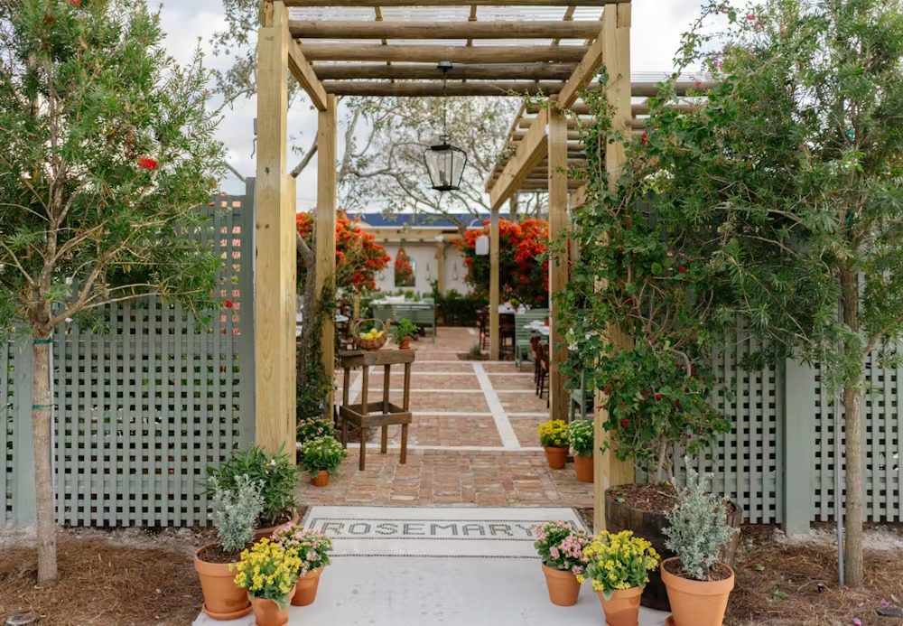The pergola entrance and mosaic Rosemary's welcome at 322 NW 25th Street, Wynwood Arts District Miami