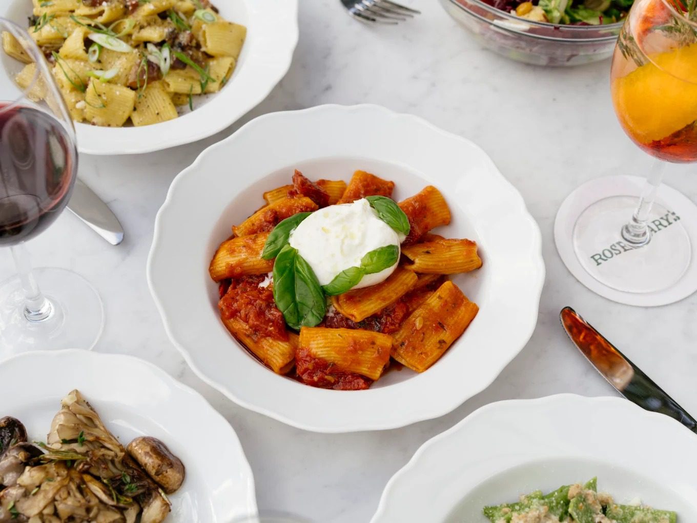 Rigatoni arrabbiata crowned with burrata and basil, with wine and seasonal plates at Rosemary's Wynwood