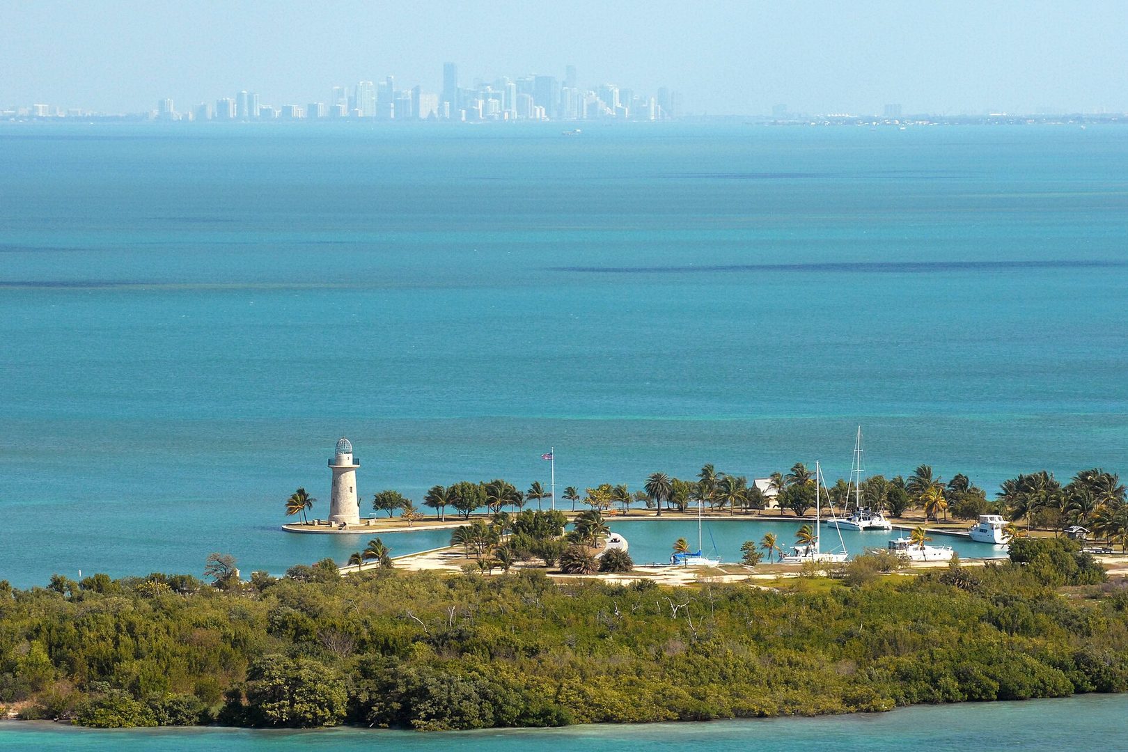 Aerial view of Biscayne Bay with Miami skyline, evoking the climate context for the article