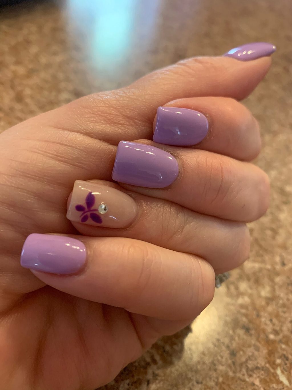 A pristine manicure with a sheer milky pink finish, exemplifying the Russian manicure technique