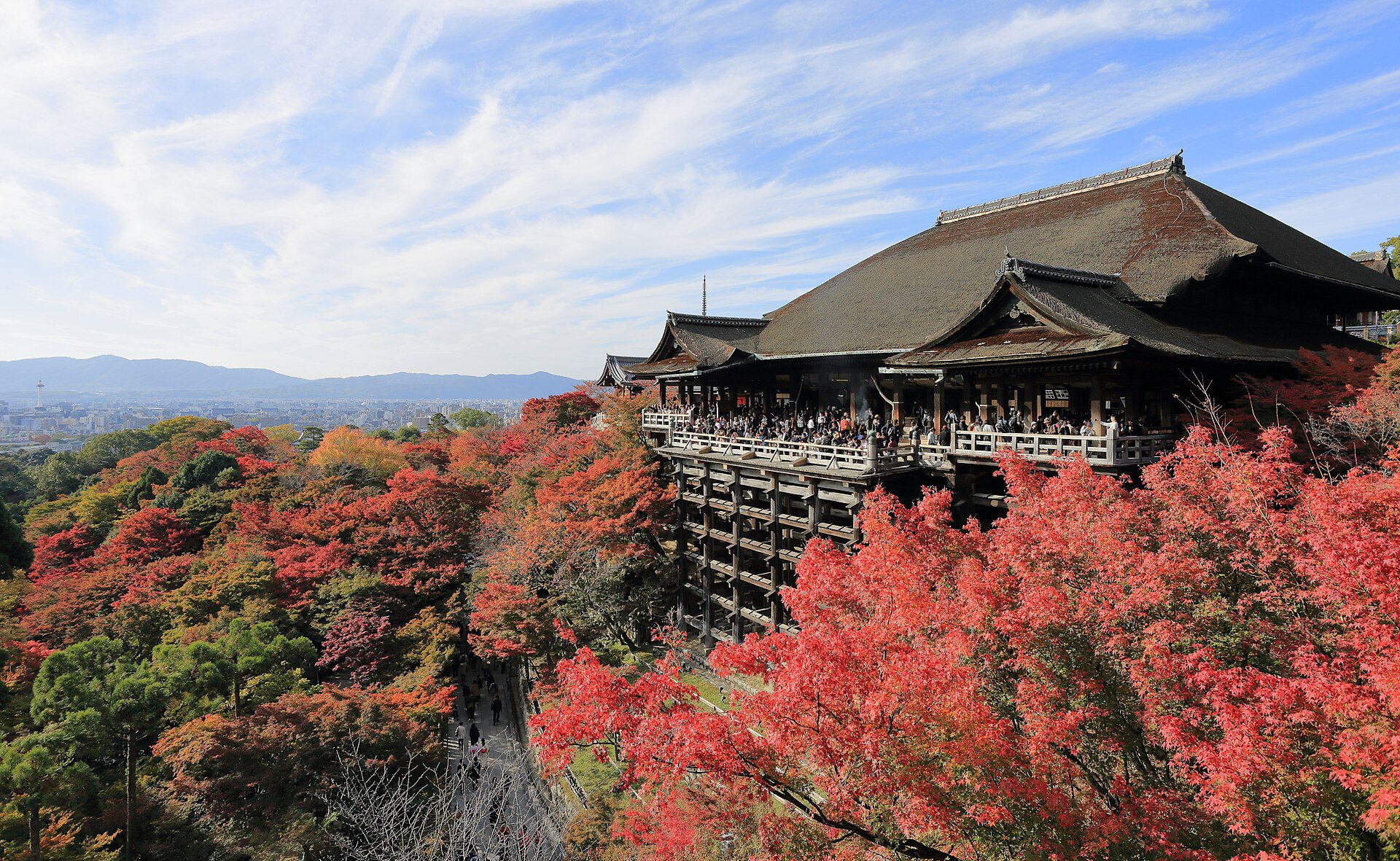 Kiyomizu-dera temple above Kyoto among red and gold autumn foliage