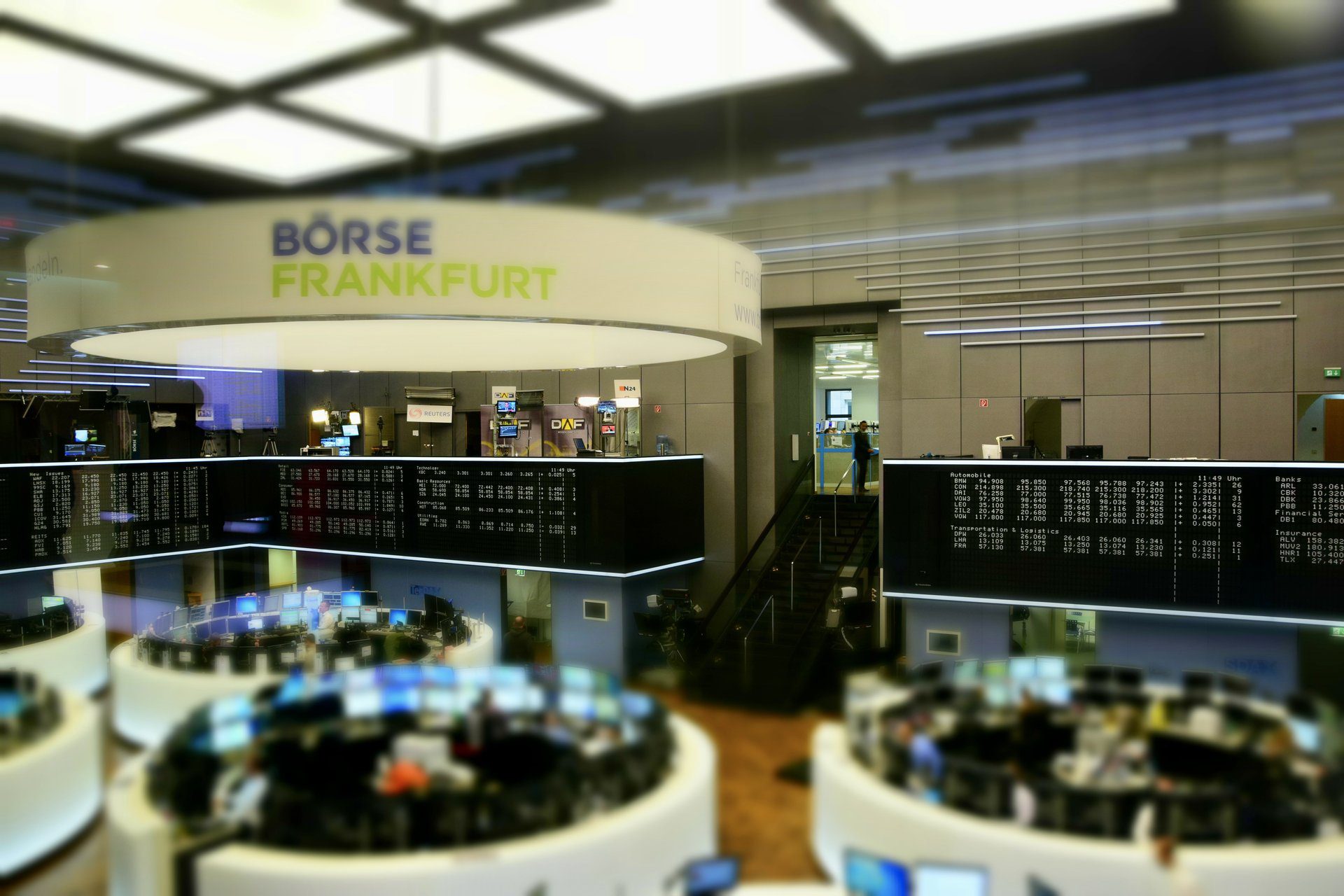 Frankfurt Stock Exchange trading floor, modern trading desks with electronic displays