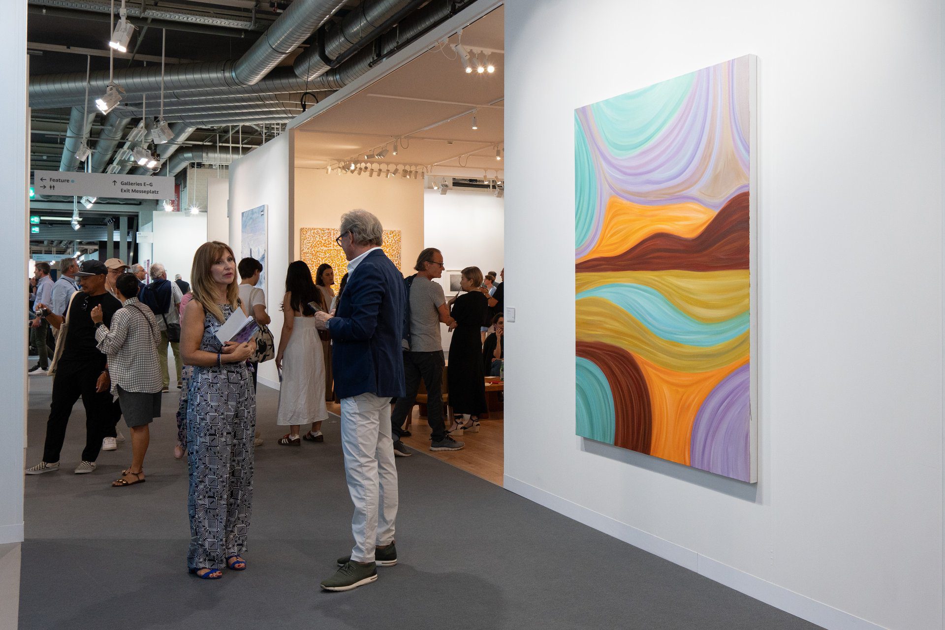 Contemporary art gallery booth at Art Basel, curated display of modern works