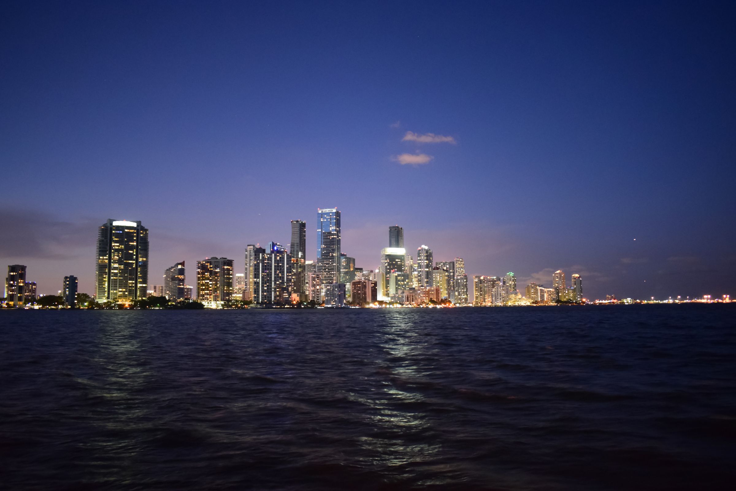 Miami skyline reflected in Biscayne Bay at twilight