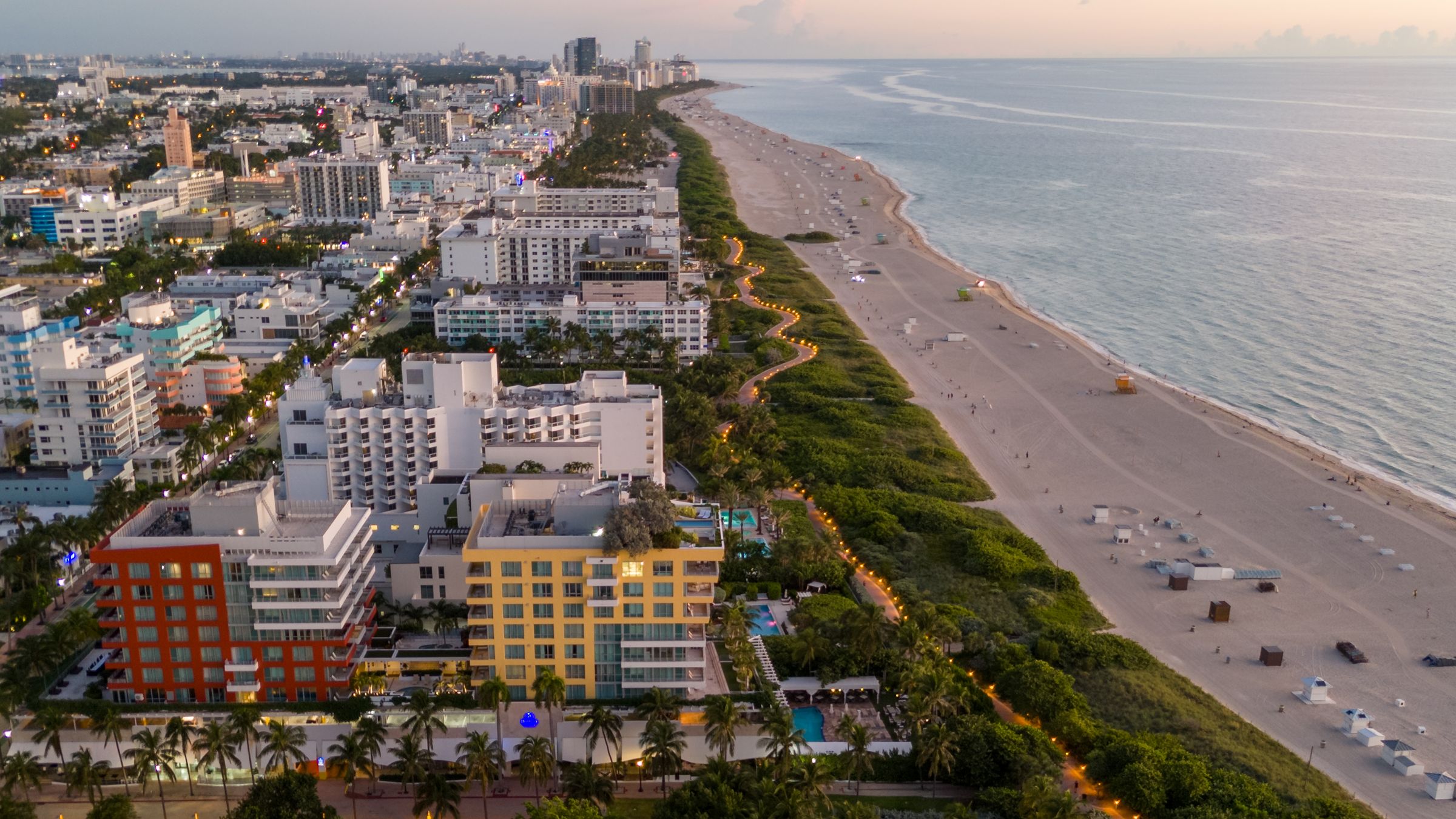 Aerial view of the Miami Beach skyline and coastline at dusk