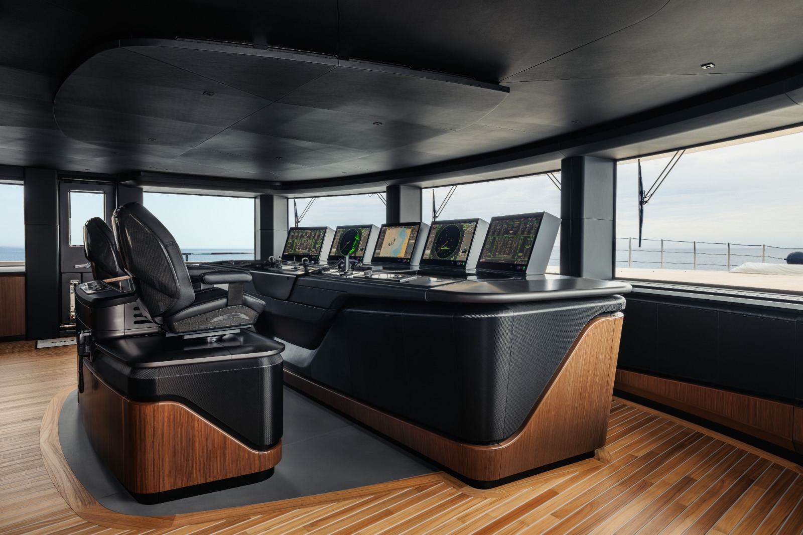Beach club of the Sanlorenzo 74Steel opening to 290 square metres at sea level with the transom door folded flush into the swim platform