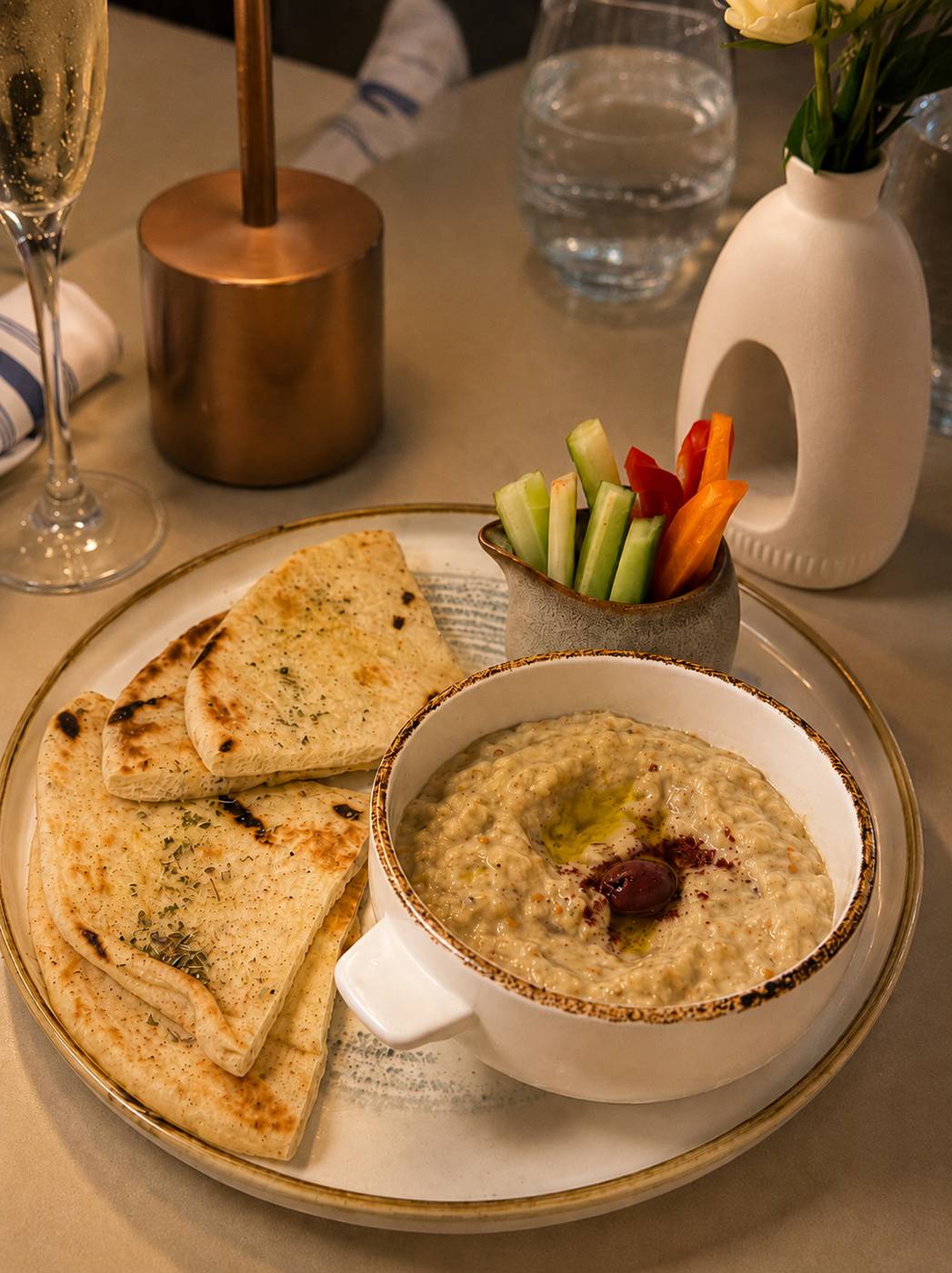 Baba ghanoush with olive oil, warm pita and crudites at Santorini by Georgios
