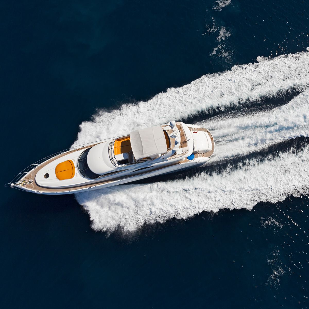 A superyacht cutting through open water