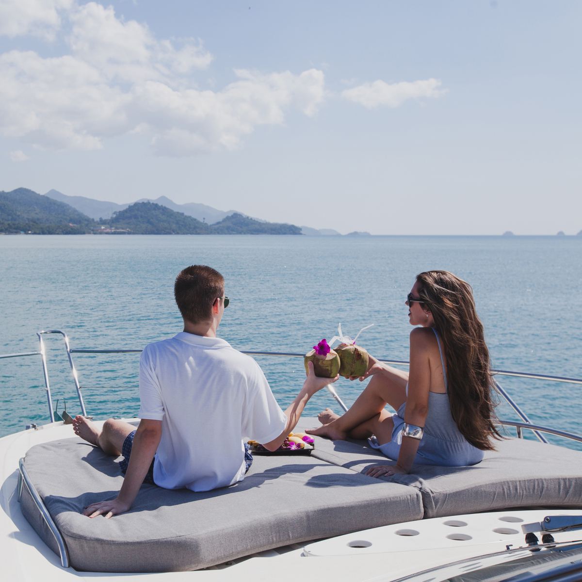 A couple aboard a luxury yacht at sea